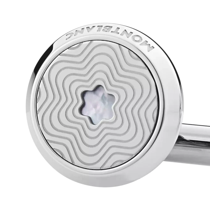 Manschettknappar, runda i rostfritt stål med exploderande stjärnmönster och emblem i pärlemor med snöklädda bergstoppar