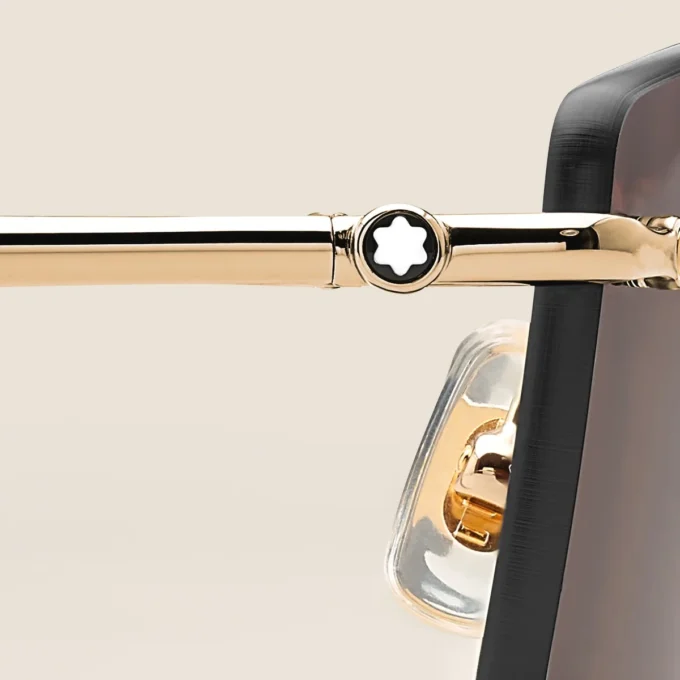 Rektangulära solglasögon med guldfärgad metallbåge